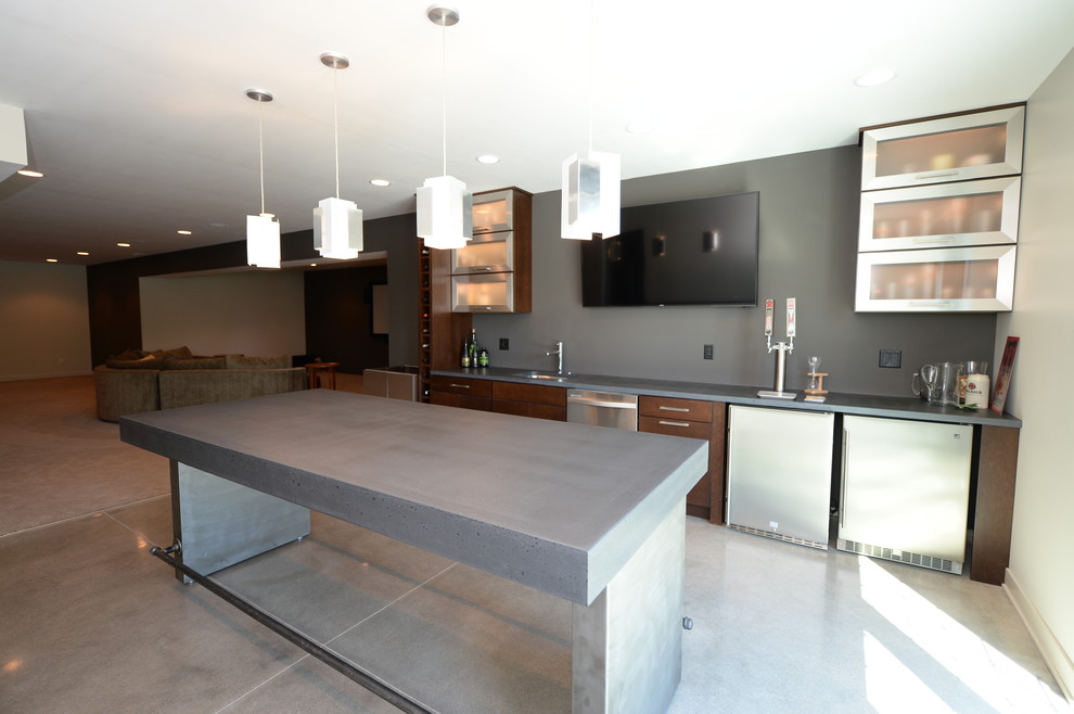 Inspiration for a mid-sized transitional walk-out concrete floor basement remodel with gray walls