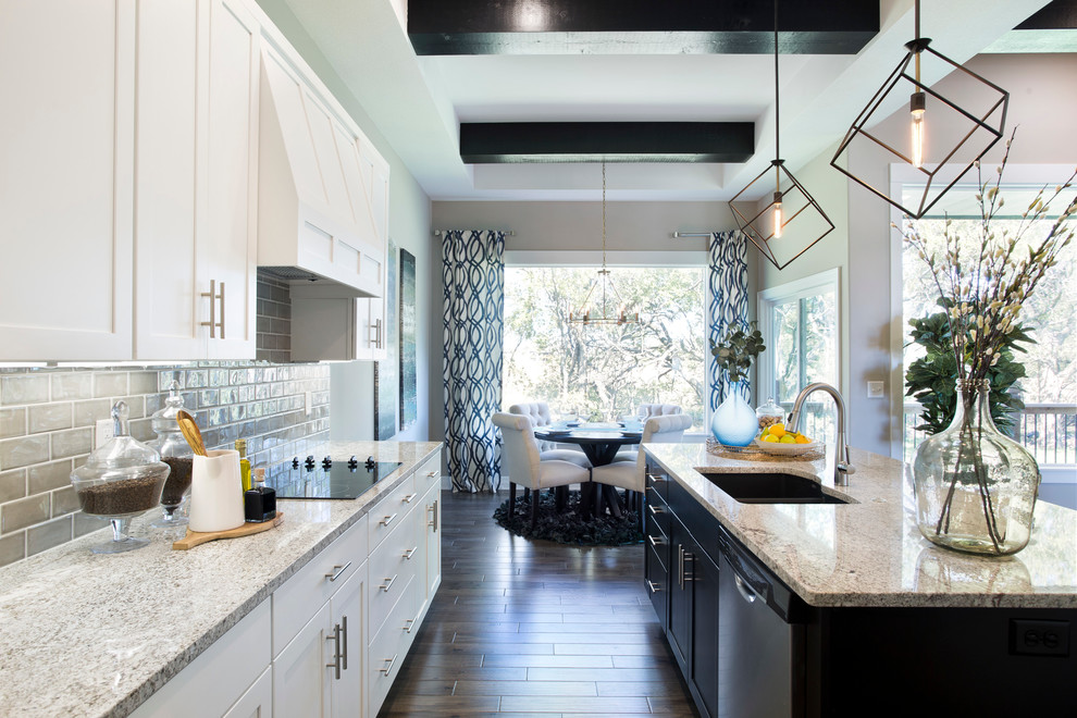 Eat-in kitchen - mid-sized transitional l-shaped medium tone wood floor eat-in kitchen idea in Wichita with an undermount sink, shaker cabinets, white cabinets, quartz countertops, gray backsplash, ceramic backsplash, stainless steel appliances and an island
