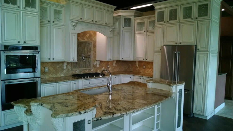 Eat-in kitchen - mid-sized transitional dark wood floor eat-in kitchen idea with a single-bowl sink, white cabinets, granite countertops, beige backsplash, stone tile backsplash, stainless steel appliances and an island