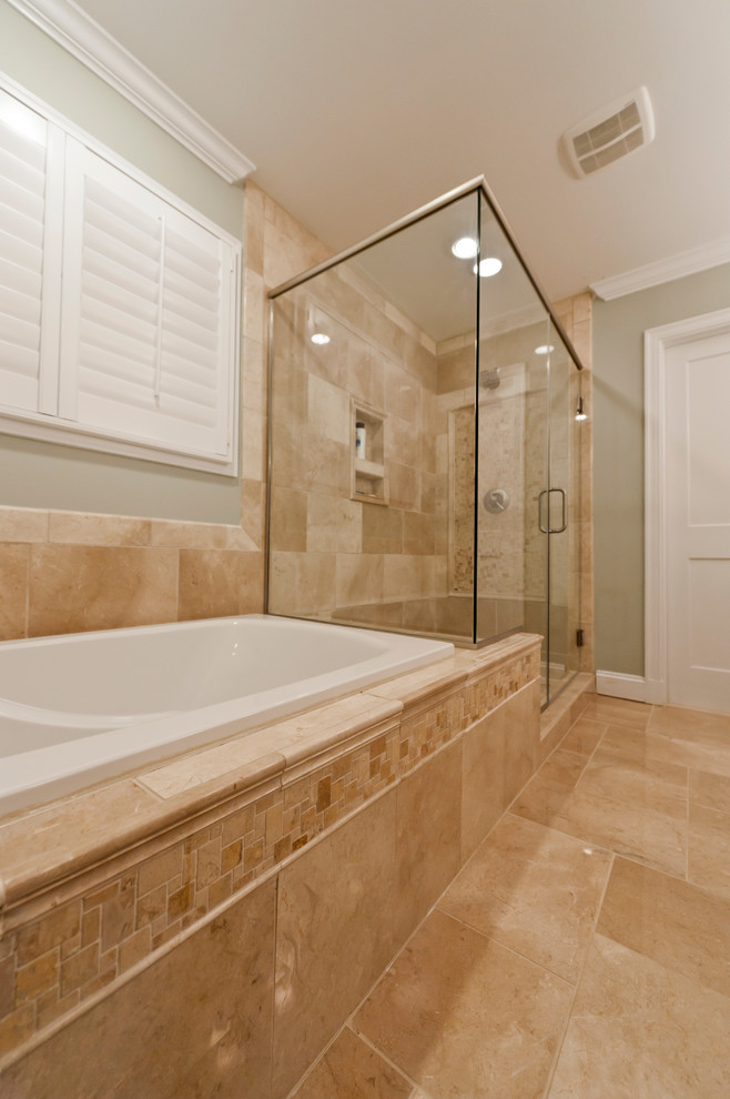 This is an example of a traditional master bathroom in Richmond with a drop-in tub, a one-piece toilet, brown tile, green walls, a pedestal sink, brown floor and a hinged shower door.