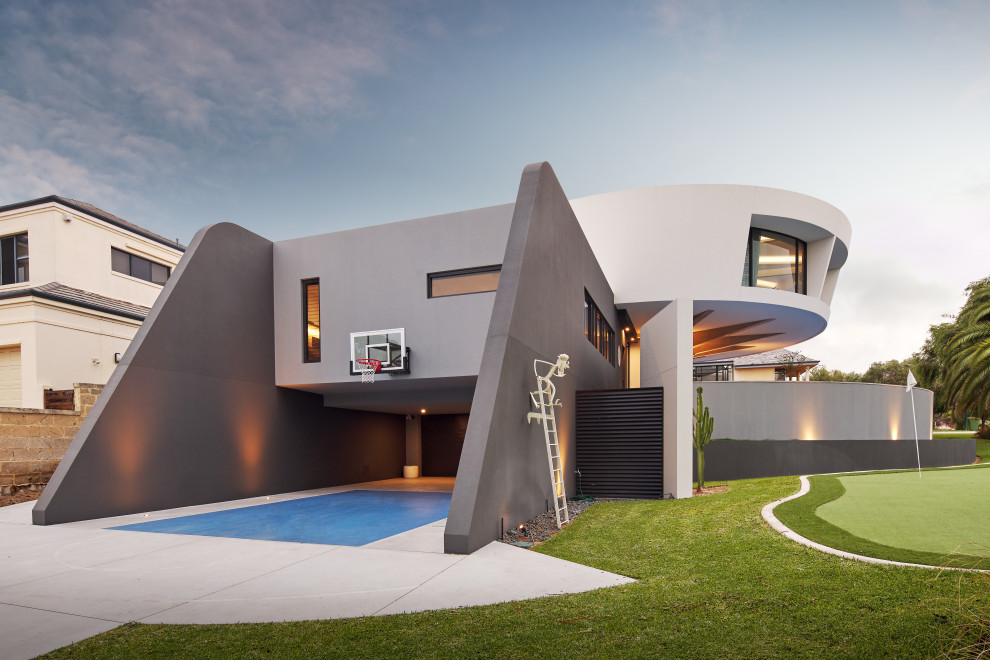 Photo of an expansive contemporary backyard full sun outdoor sport court in Perth.