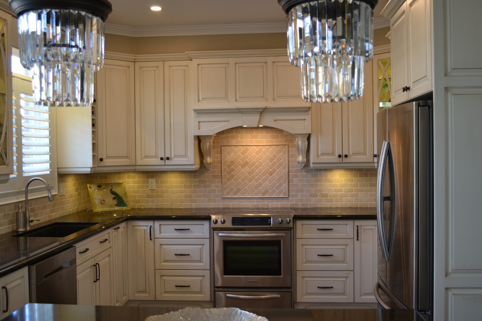 Example of a mid-sized transitional galley dark wood floor eat-in kitchen design in Toronto with a drop-in sink, raised-panel cabinets, beige cabinets, quartz countertops, beige backsplash, stone tile backsplash, stainless steel appliances and an island