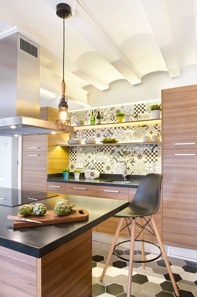 Inspiration for a mid-sized contemporary galley open plan kitchen in Madrid with an undermount sink, flat-panel cabinets, medium wood cabinets, solid surface benchtops, multi-coloured splashback, ceramic splashback, ceramic floors and with island.