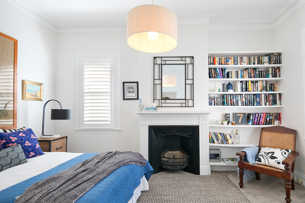 Design ideas for a transitional guest bedroom in Sydney with white walls, carpet, a standard fireplace, grey floor and a metal fireplace surround.
