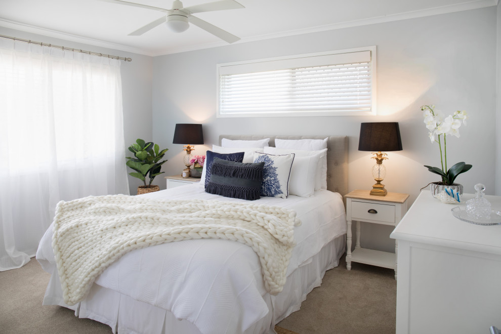 This is an example of a mid-sized transitional master bedroom in Brisbane with grey walls, carpet and grey floor.
