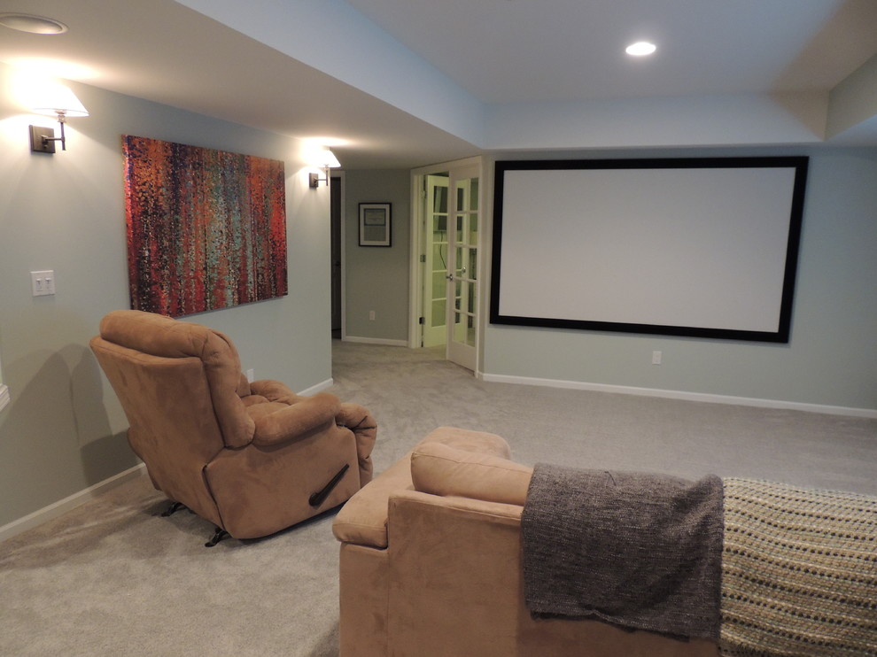 Inspiration for a mid-sized traditional home theatre in Detroit with grey walls and carpet.