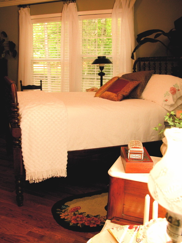This is an example of a tropical bedroom in Atlanta.