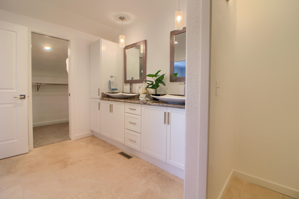 This is an example of a medium sized contemporary ensuite wet room bathroom in Miami with shaker cabinets, white cabinets, white walls, a vessel sink, granite worktops and a hinged door.