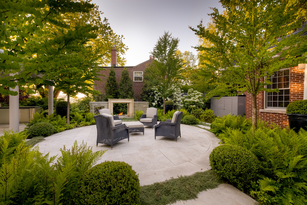 Transitional garden in Toronto with a fire feature.