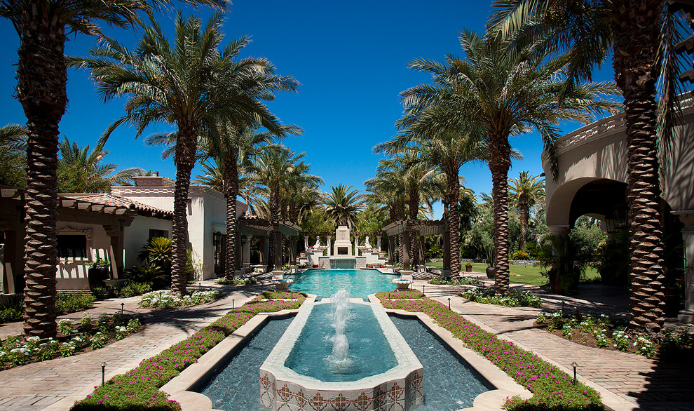 Pool fountain - huge transitional backyard brick and rectangular pool fountain idea in Phoenix