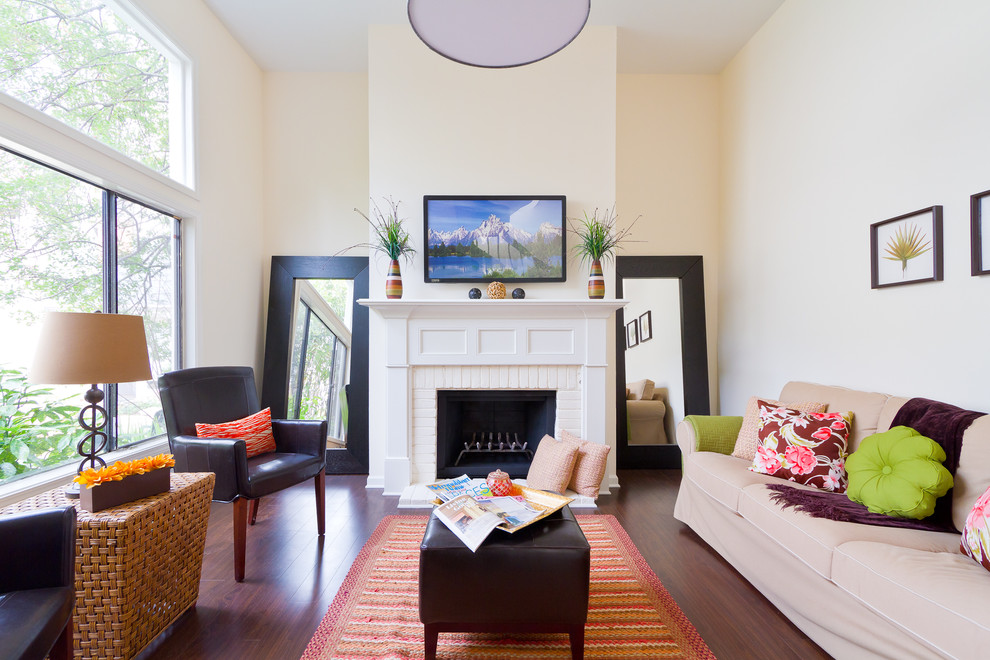 This is an example of a contemporary living room in Atlanta with yellow walls.