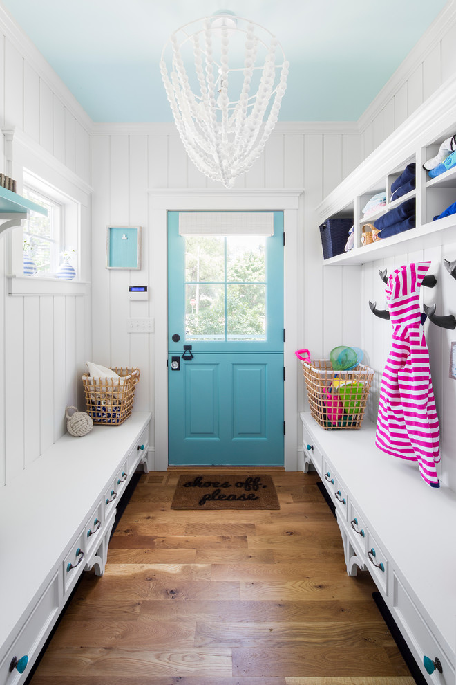 Inspiration for a beach style entryway in Boston with white walls, medium hardwood floors, a dutch front door and a blue front door.