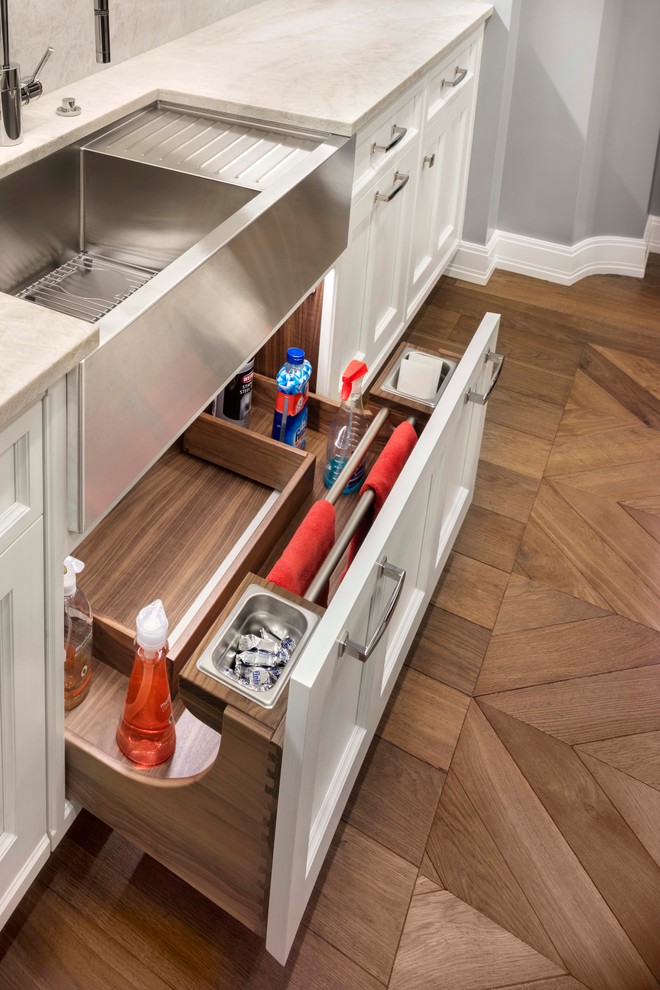 Inspiration for a transitional medium tone wood floor kitchen remodel in Denver with an undermount sink, shaker cabinets, white cabinets, white backsplash and stainless steel appliances