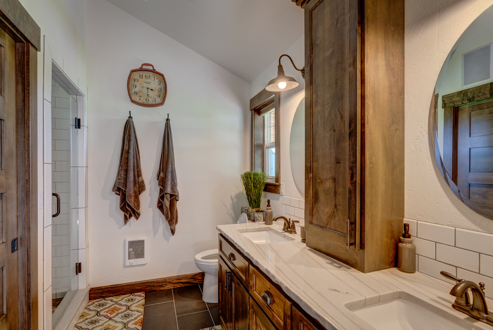 Inspiration for a mid-sized country master bathroom in Seattle with an undermount sink, shaker cabinets, medium wood cabinets, quartzite benchtops, a double shower, a two-piece toilet, white tile, subway tile, white walls and porcelain floors.