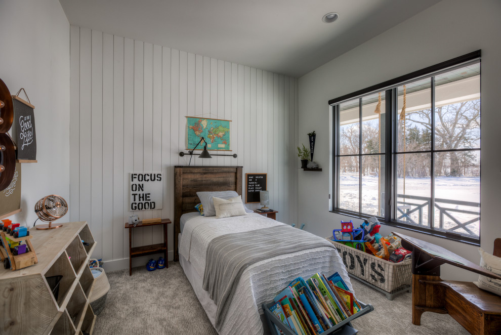 Country kids' room in Omaha with white walls, carpet and grey floor.