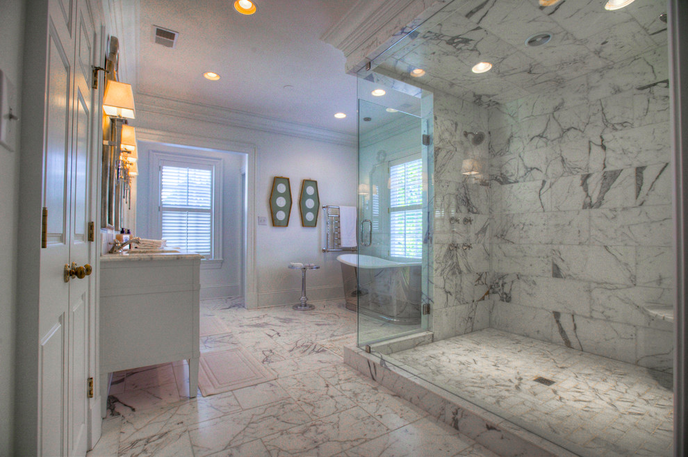 Mid-sized transitional master gray tile, white tile and stone slab marble floor freestanding bathtub photo in Charlotte with shaker cabinets, white cabinets, a two-piece toilet, white walls, an undermount sink and marble countertops