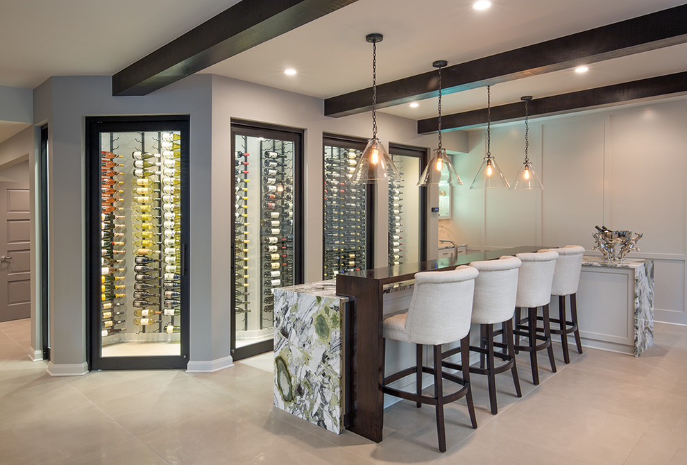 Photo of a contemporary l-shaped seated home bar in Columbus with shaker cabinets, white cabinets and beige floor.