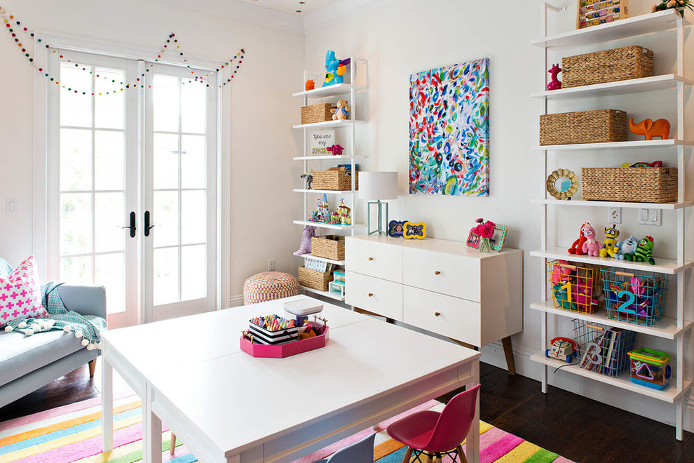Transitional kids' room in Orange County with white walls and dark hardwood floors.