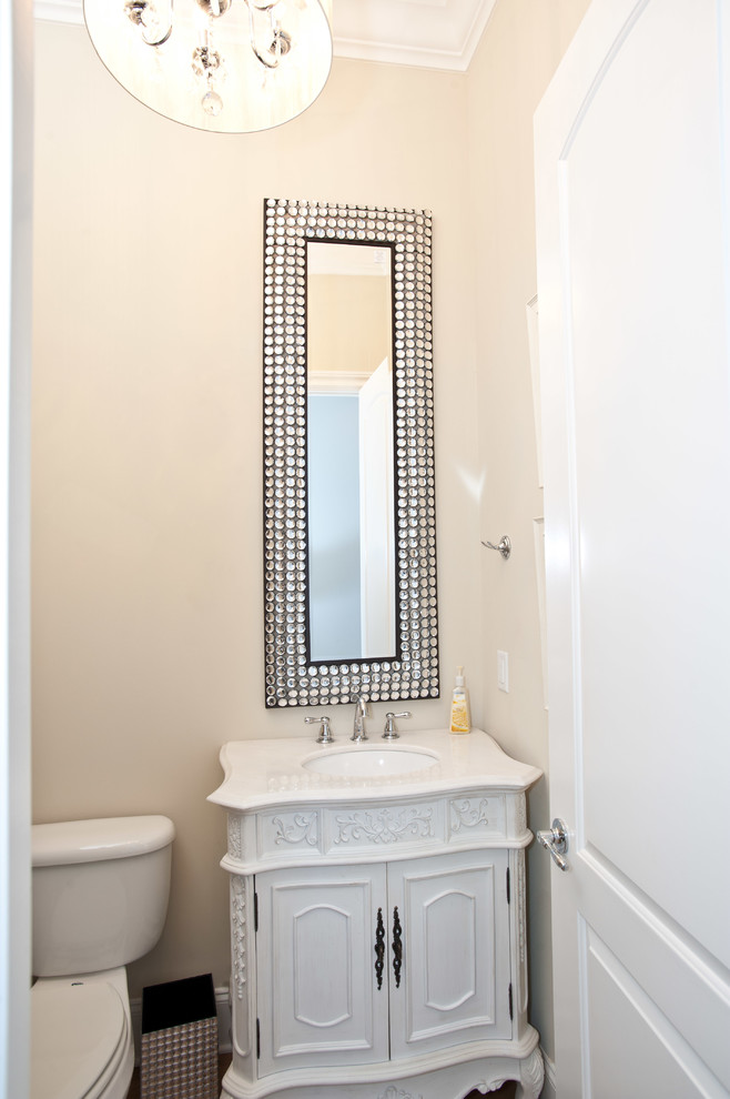 Inspiration for a small traditional 3/4 bathroom in Nashville with an undermount sink, furniture-like cabinets, white cabinets, granite benchtops, a one-piece toilet and beige walls.