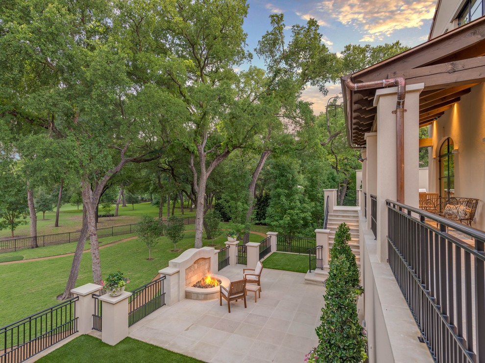 Photo of a mediterranean patio in Dallas with a fire feature.
