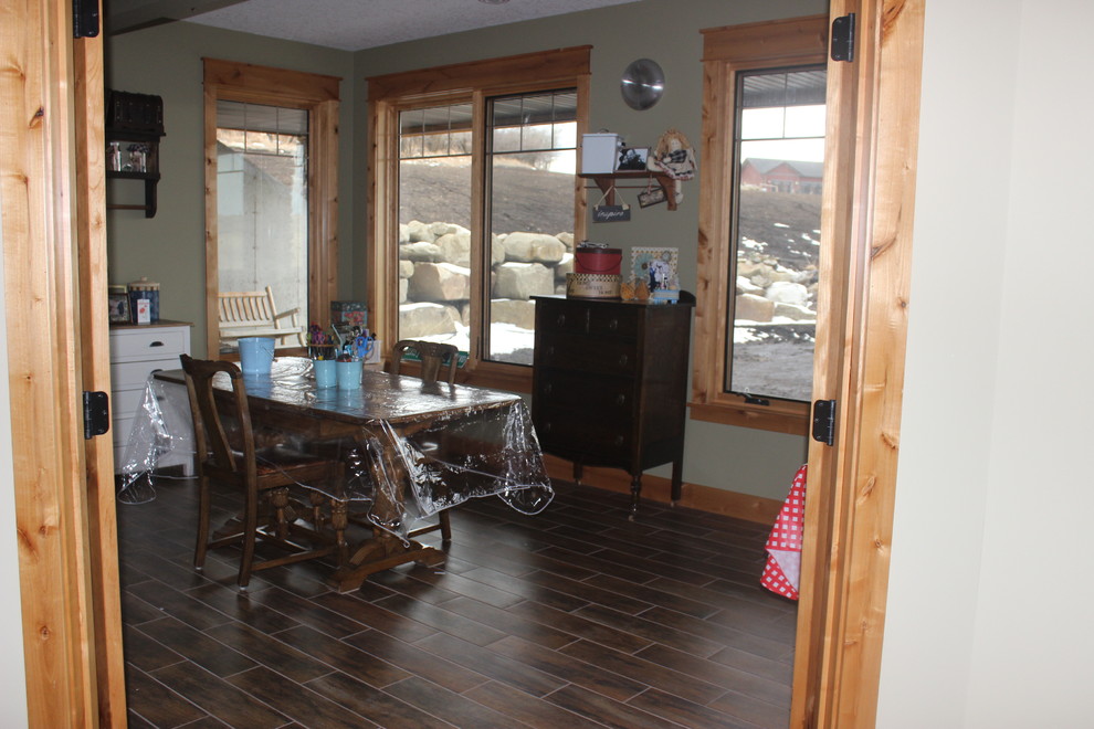 Example of a mountain style home design design in Calgary
