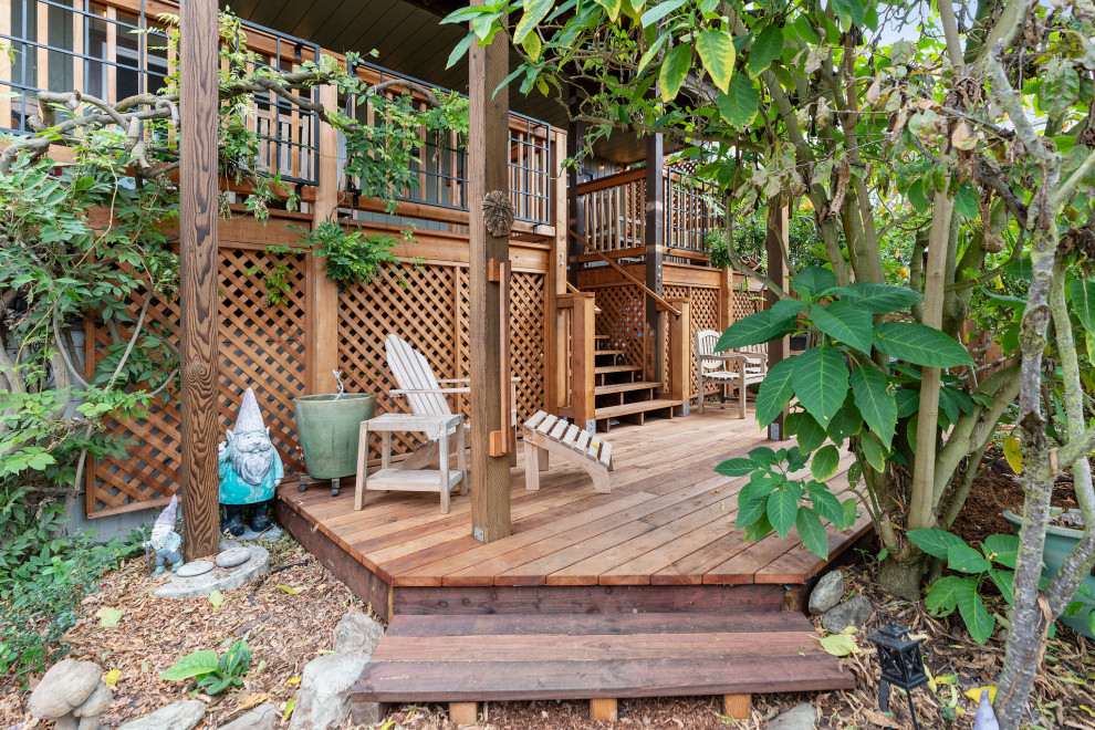 Deck - large rustic backyard ground level wood railing deck idea in San Francisco with no cover