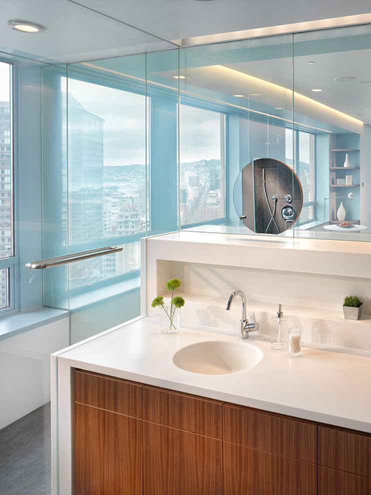 Photo of a large modern master bathroom in San Francisco with medium wood cabinets, an integrated sink, white tile, flat-panel cabinets, an alcove shower, engineered quartz benchtops and white benchtops.