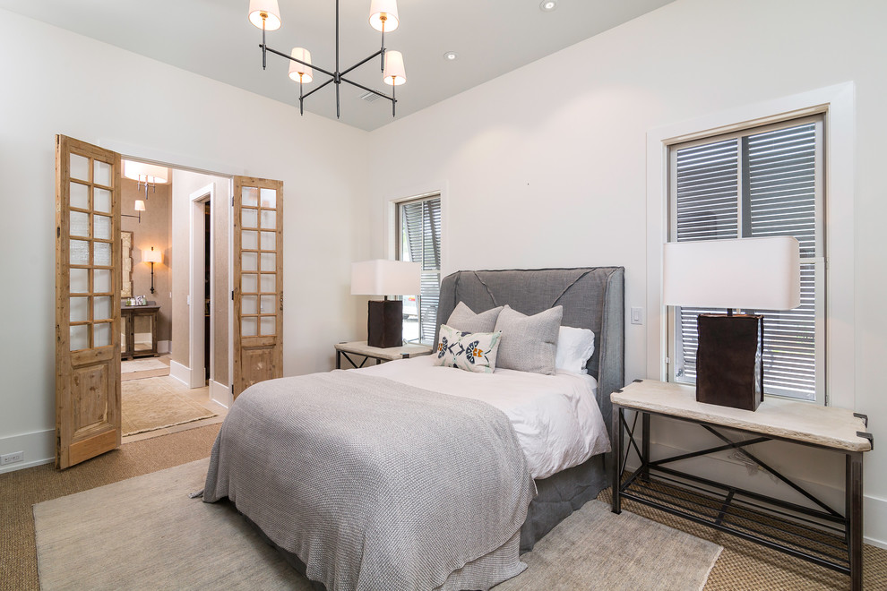 Mid-sized beach style guest bedroom in Atlanta with white walls, carpet and no fireplace.