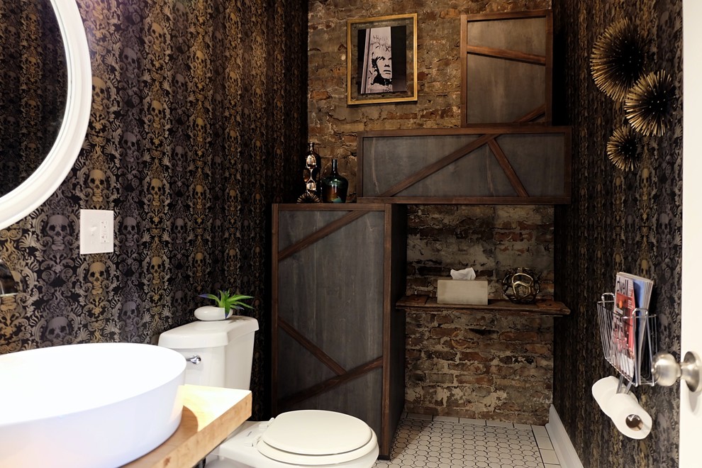 This is an example of a small eclectic 3/4 bathroom in Chicago with flat-panel cabinets, blue cabinets, a two-piece toilet, black walls, ceramic floors, a vessel sink, wood benchtops and white floor.