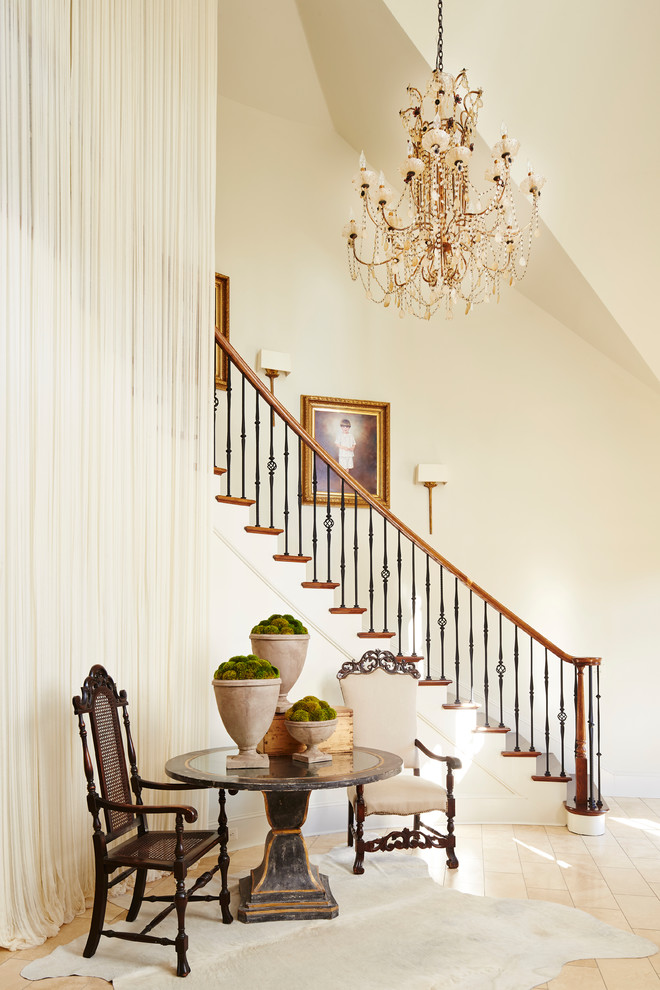 Inspiration for a traditional wood curved staircase in Other with painted wood risers and mixed railing.