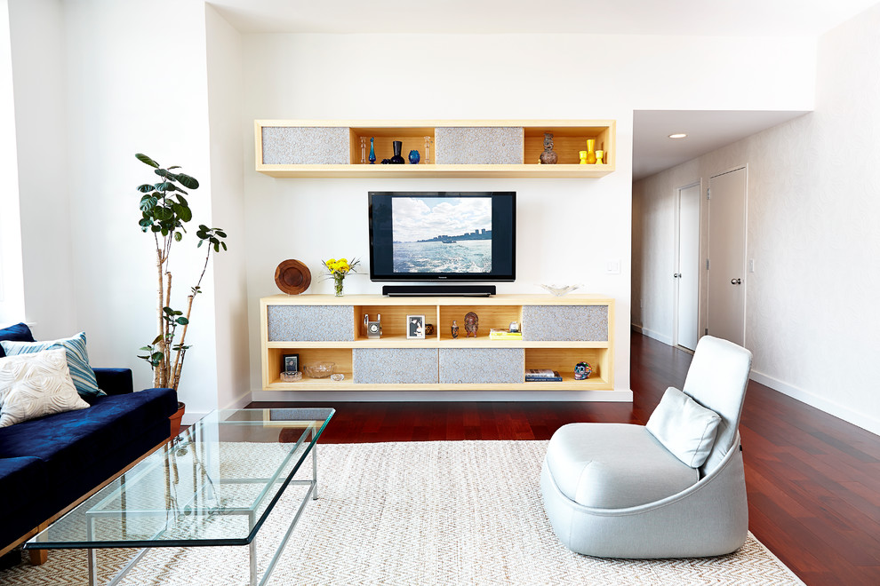 Mid-sized trendy medium tone wood floor family room photo in New York with white walls, a wall-mounted tv and no fireplace