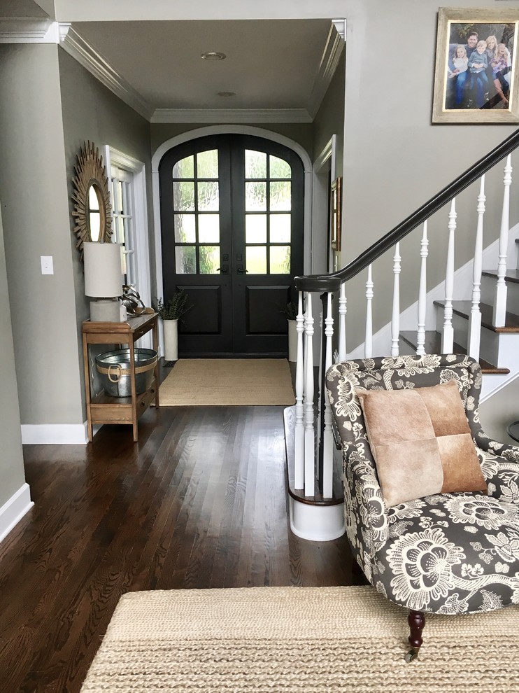 Inspiration for a mid-sized country hallway with dark hardwood floors, grey walls and brown floor.