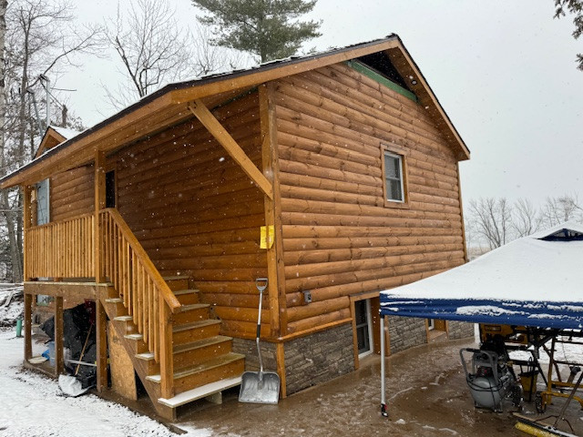 Log Siding, Stamped Concrete and Post and Beam Carport
