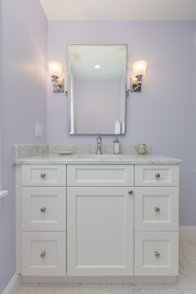 Design ideas for a small traditional kids bathroom in Boston with flat-panel cabinets, white cabinets, an alcove tub, a shower/bathtub combo, white tile, subway tile, purple walls, marble floors, an undermount sink, marble benchtops, white floor and a shower curtain.
