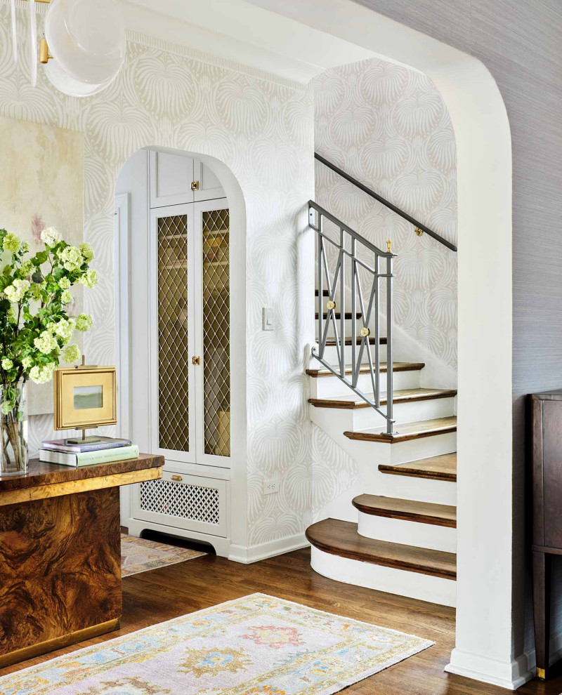 This is an example of a mid-sized traditional foyer in Austin with wallpaper.