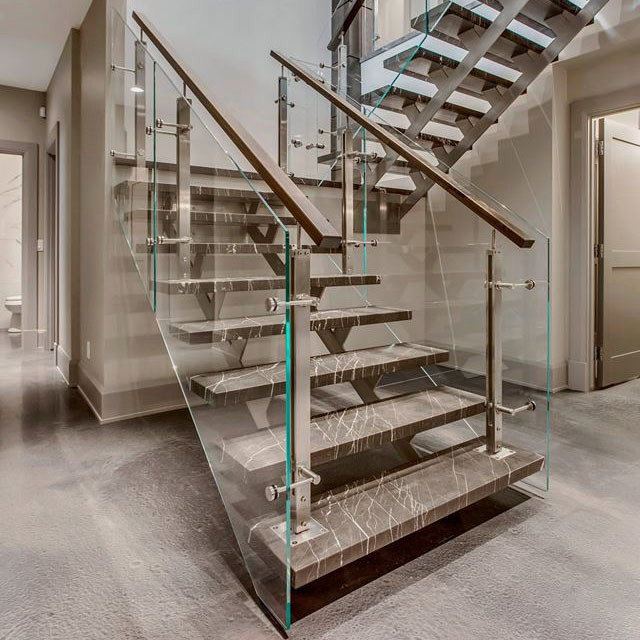 Diseño de escalera en U contemporánea de tamaño medio con barandilla de varios materiales