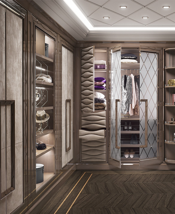 Photo of a mid-sized gender-neutral walk-in wardrobe in New York with dark hardwood floors, brown floor and wood.