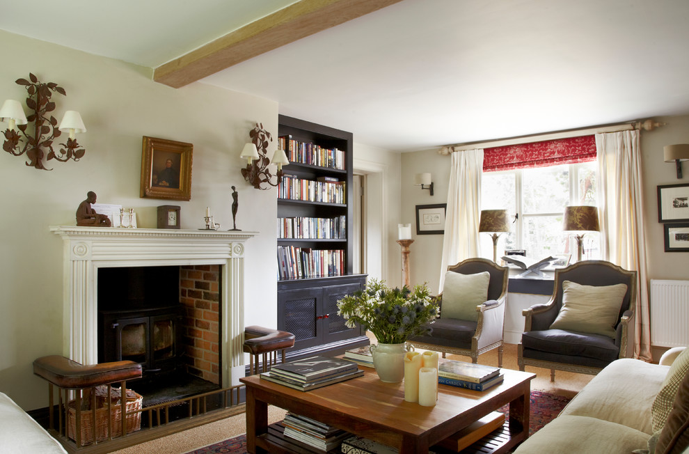 Mid-sized country enclosed living room in Wiltshire with carpet and a wall-mounted tv.