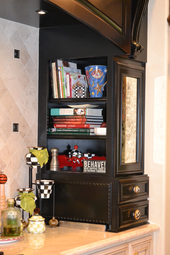 Large traditional l-shaped eat-in kitchen in Orlando with recessed-panel cabinets and black cabinets.