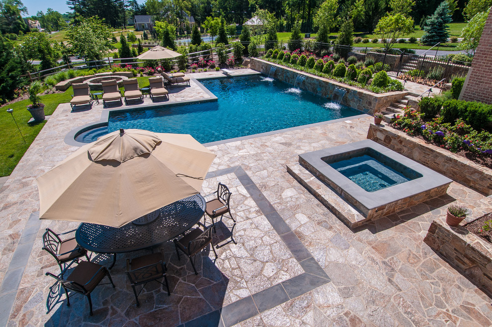 Inspiration for an expansive arts and crafts side yard pool in Baltimore with natural stone pavers.
