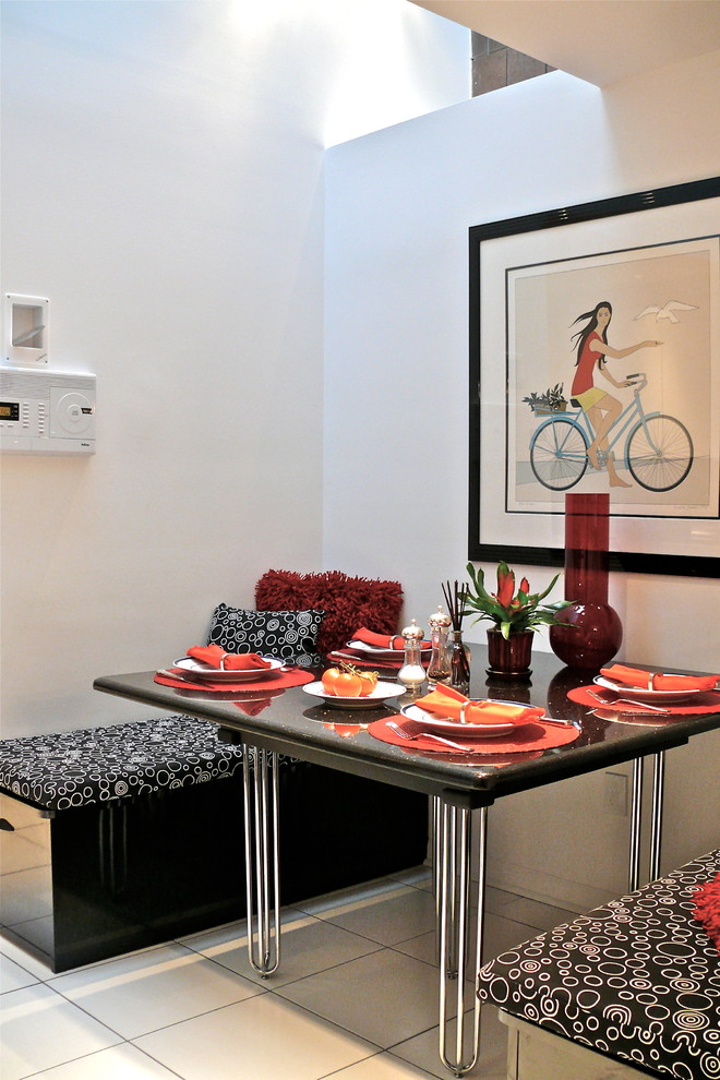 Small trendy ceramic tile kitchen/dining room combo photo in New York with white walls