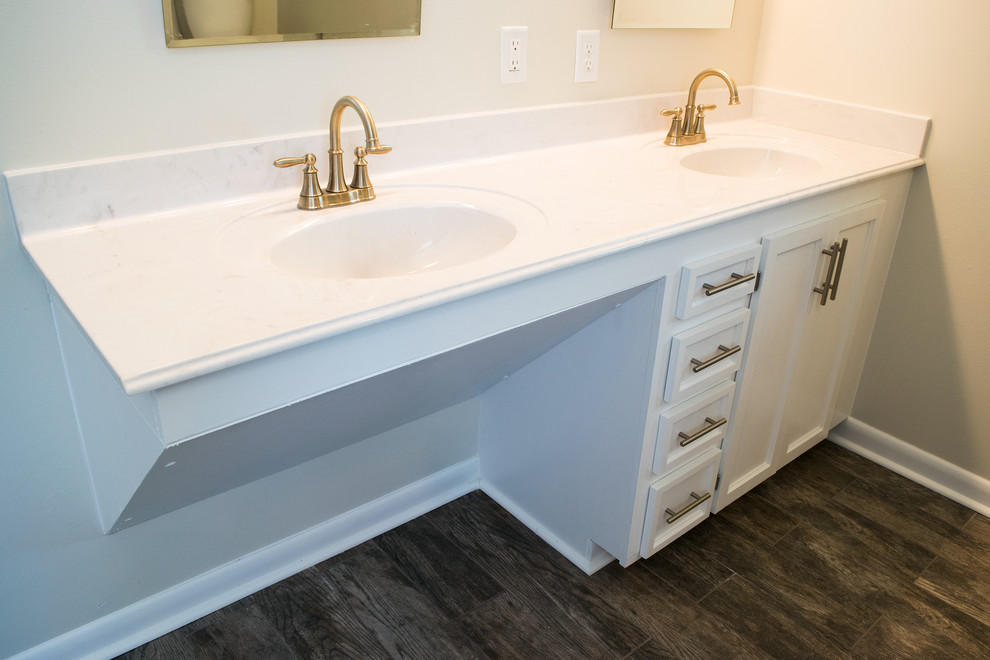 Walk-in shower - large transitional master ceramic tile and brown floor walk-in shower idea with recessed-panel cabinets, white cabinets, marble countertops, a two-piece toilet, beige walls and an integrated sink