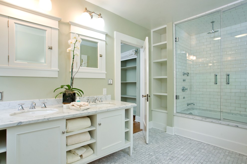 Mid-sized traditional master bathroom in Chicago with recessed-panel cabinets, white cabinets, an alcove tub, a shower/bathtub combo, white tile, ceramic tile, green walls, mosaic tile floors, an undermount sink and quartzite benchtops.