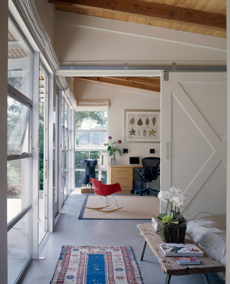 Design ideas for a contemporary home office in Santa Barbara with concrete floors.