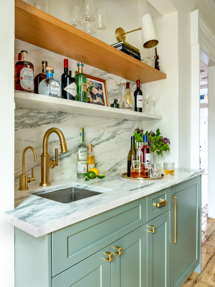 Photo of a small midcentury galley wet bar in New York with an undermount sink, shaker cabinets, green cabinets, marble benchtops, multi-coloured splashback, marble splashback and multi-coloured benchtop.