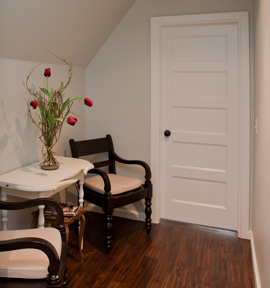 Small transitional dark wood floor hallway photo in Oklahoma City with beige walls