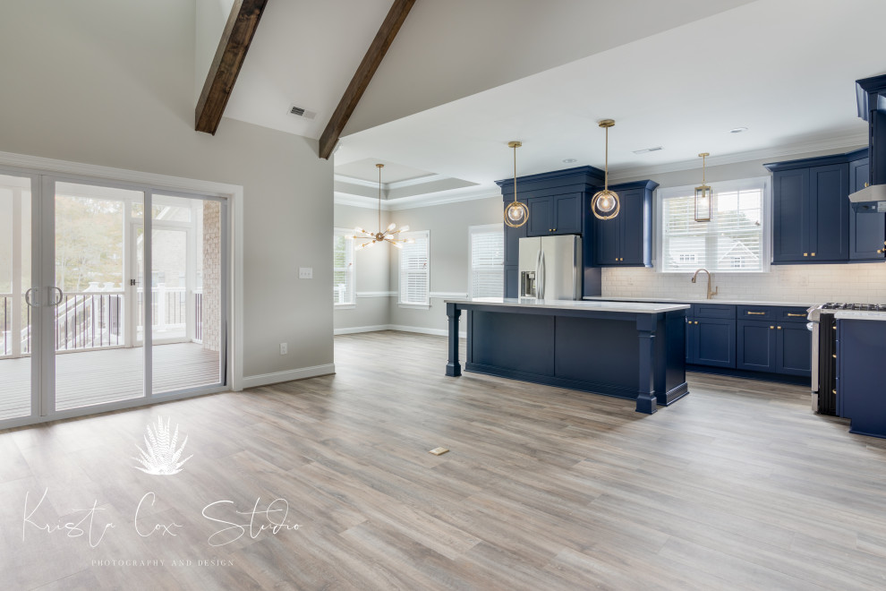 Kitchen - transitional kitchen idea with shaker cabinets, blue cabinets and an island