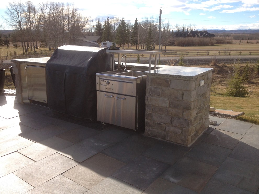 Example of a mountain style kitchen design in Calgary