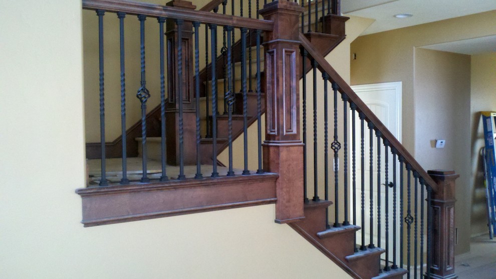 Mid-sized traditional u-shaped staircase in Boise with mixed railing.