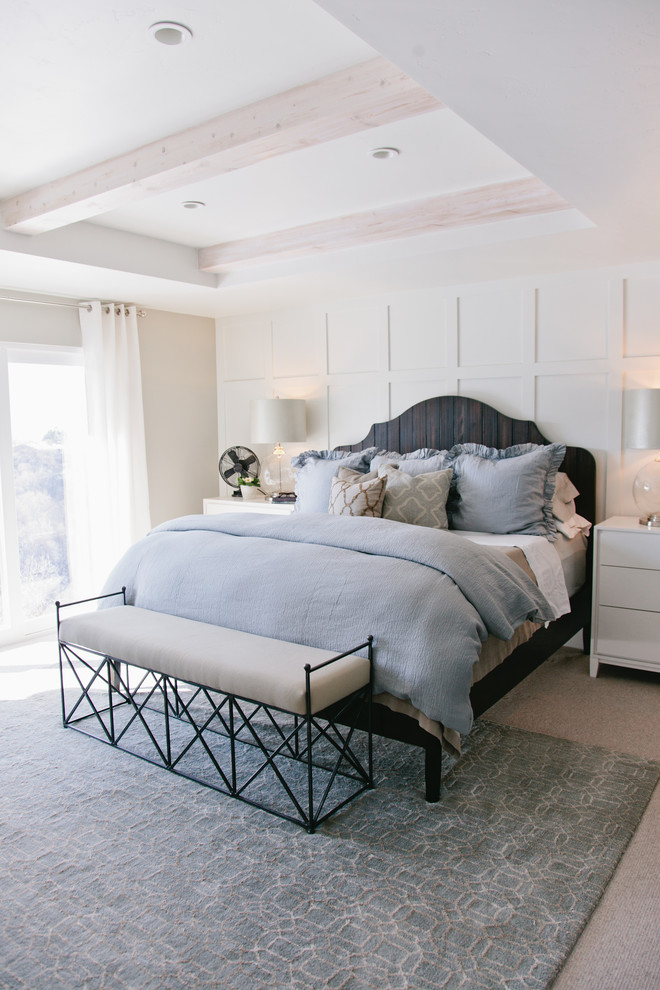 Design ideas for a mid-sized transitional master bedroom in Salt Lake City with beige walls and carpet.